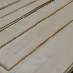 Sheets of rotary-cut birch veneer extra grade stacked on pallets
