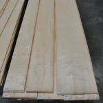 Pallets with natural sliced European birch veneer 0.6 mm in an industrial warehouse