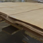Side cut of a natural sliced birch veneer bundle showing 0.6 mm thickness