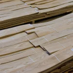 Pallets with packs of sliced oak veneer grade 2 at the WoodWay Expert warehouse.