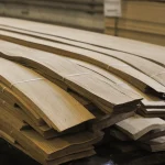 Ends of sliced oak veneer packs demonstrating sheet thickness of 0.6 mm.