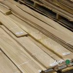 Packs of natural sliced oak veneer 0.6 mm thick in the warehouse
