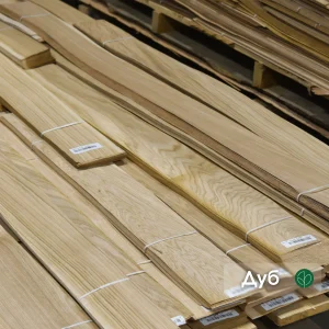 Packs of natural sliced oak veneer 0.6 mm thick in the warehouse