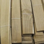 Sheets of natural sliced oak veneer tied into packs with white bands