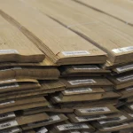 Ends of sliced oak veneer packs showing 0.6 mm thickness