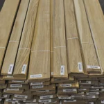 Stacked packs of sawn oak veneer with barcode labels