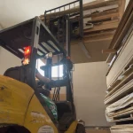 Forklift moving pallets with sawn oak veneer at WoodWay Expert warehouse