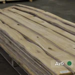 Natural sliced oak veneer sheets with knots 0.6 mm thick in packs on pallet