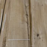 Natural oak wood pattern with knots and cracks on sliced veneer sheet