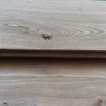 Decorative knot on the surface of natural sliced oak veneer