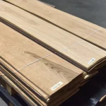 Bundles of natural sliced oak veneer 1.5 mm stacked on a wooden pallet