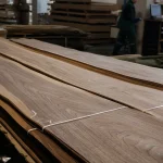 Sheets of sliced American walnut veneer 2 to 3.8 meters long on a work table