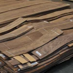 Pallets with packs of sliced American walnut veneer in the WoodWay Expert warehouse.