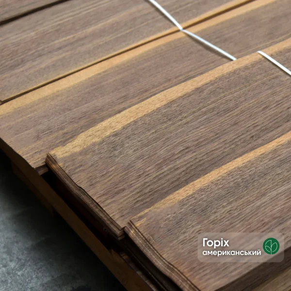 A bundle of natural sliced American walnut veneer 0.6 mm thick in the warehouse