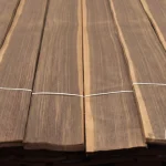 Sheets of natural sliced American walnut veneer laid out in a row