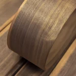 Bent sheet of flexible sliced American walnut veneer