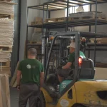 Forklift and workers at the WoodWay Expert veneer warehouse