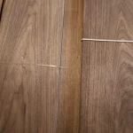 Texture and natural grain pattern of sliced American Walnut veneer.