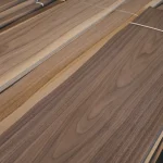 Detailed view of the surface and fibers of natural sliced American Walnut veneer.