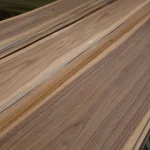 Sheets of extra grade sliced American Walnut veneer stacked in packs.