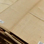 Thin sheets of sliced maple veneer 0.6 mm thick with barcode labels.