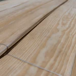 Texture and annual ring pattern of natural sliced pine veneer.