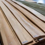 Packs of Grade 1 European sliced pine veneer stacked on a pallet.