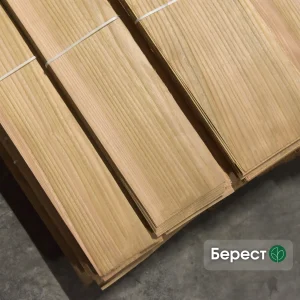 Packs of natural sliced elm veneer 0.6 mm thick in a warehouse