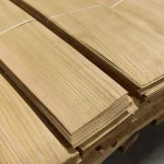 Edges of sliced elm veneer packs showing 0.6 mm sheet thickness