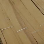 Detailed view of sliced beech veneer surface with strapping bands
