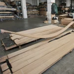 Demonstration of flexibility of a long sliced beech veneer sheet in the warehouse