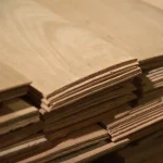 Edges of sliced beech veneer sheets showing 2.5 mm thickness.