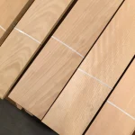 Surface of several sliced beech veneer sheets with natural pattern.