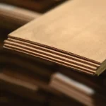 Detailed view of the edge of a beech veneer stack, 2.5 mm thick.