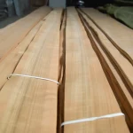 Bundles of natural sliced cherry veneer in the WoodWay Expert warehouse.