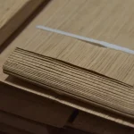 Edges of sliced oak veneer sheets 0.6 mm thick in a pack