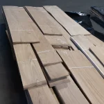 Pallets with packs of 1.5 mm first grade sliced oak veneer in the warehouse.