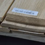 Edge of 1.5 mm oak veneer bundle with barcode label
