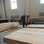 Sorting and stacking sliced oak veneer in the warehouse