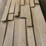 Bundles of natural sliced oak veneer from 0.8 to 2.05 meters long on a pallet.