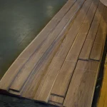 Laid out sheets of sliced American walnut veneer with lengths from 2 to 3.8 meters.