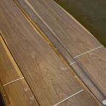 Close-up of strapped packs of first-grade natural sliced American walnut veneer.