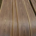 Smooth sheets of sliced American walnut veneer with prominent wood grain.