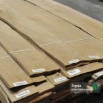 Packs of natural sliced European Walnut veneer 0.6 mm thick with barcode labels.