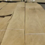 Texture and grain pattern of natural sliced European Walnut wood veneer.