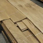 Sheets of sliced European Walnut veneer stacked on a pallet.