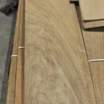 Detailed view of the wood grain pattern of sliced European Walnut veneer.