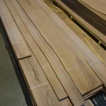 Long packs of sliced European walnut veneer 2-3.8 m on a pallet.