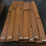 Pallet with bundles of 1st grade natural sliced makore veneer in the warehouse.