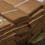 Stack of sliced makore veneer bundles at WoodWay Expert warehouse.